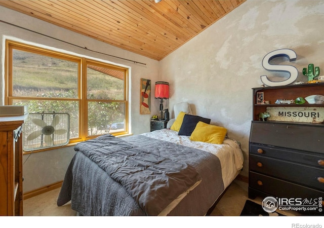 bedroom featuring wood ceiling, lofted ceiling, and multiple windows