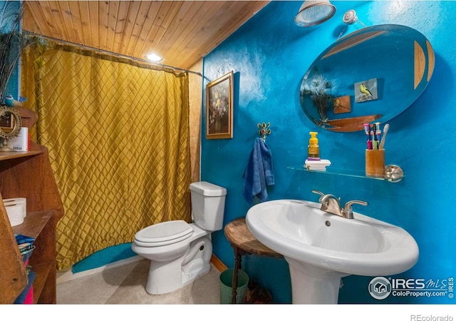 bathroom featuring sink, wood ceiling, and toilet