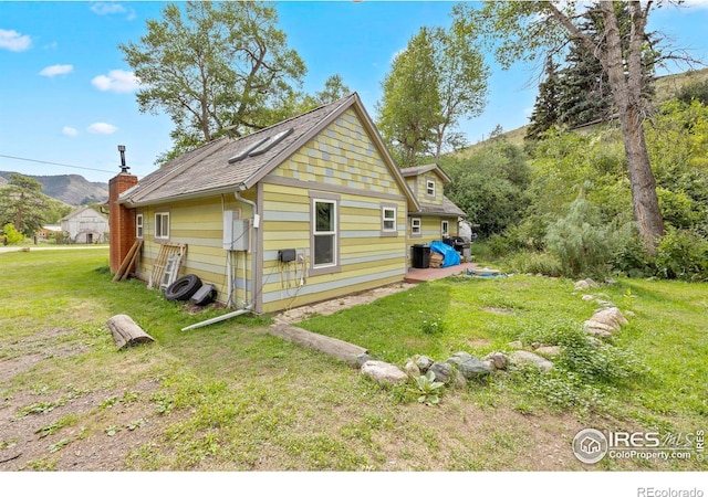 view of home's exterior featuring a yard