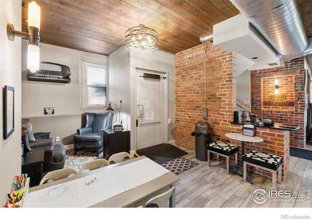 living room with wooden ceiling, brick wall, and light wood-type flooring