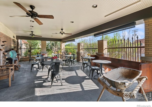 view of patio featuring ceiling fan