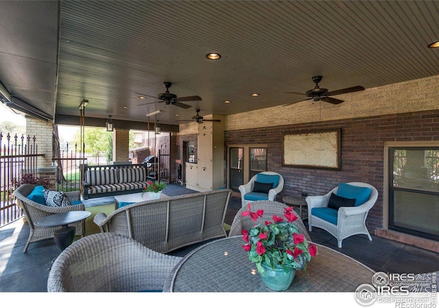 view of patio with an outdoor hangout area and ceiling fan