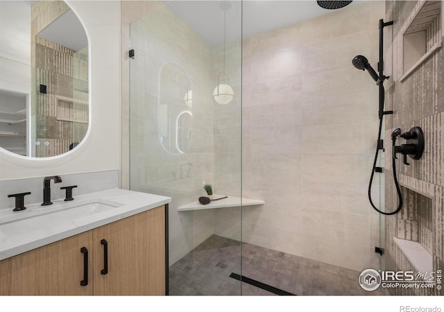 bathroom featuring vanity and walk in shower