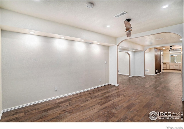 empty room featuring dark hardwood / wood-style flooring