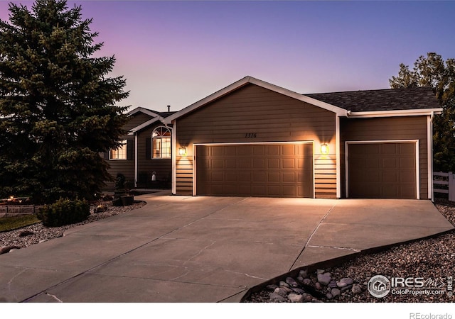 ranch-style home featuring a garage