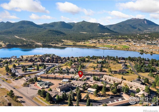 bird's eye view featuring a water and mountain view