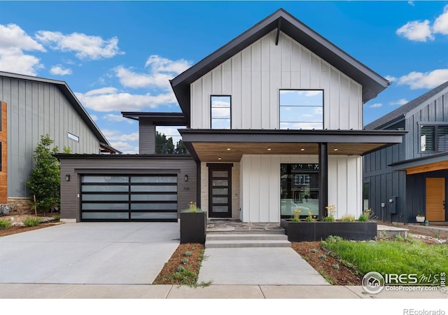 view of front of home with a garage and covered porch