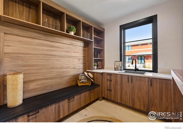 kitchen featuring sink and light wood-type flooring