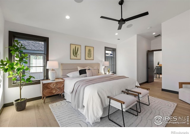 bedroom with light wood-type flooring, ceiling fan, and lofted ceiling