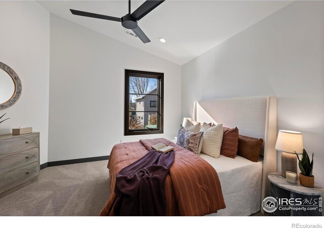 carpeted bedroom featuring ceiling fan and vaulted ceiling