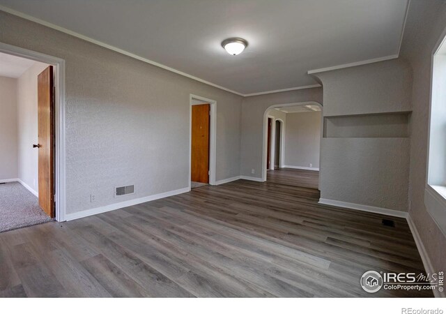 empty room featuring wood-type flooring