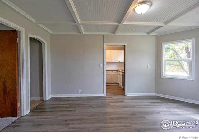 unfurnished bedroom with hardwood / wood-style flooring and coffered ceiling