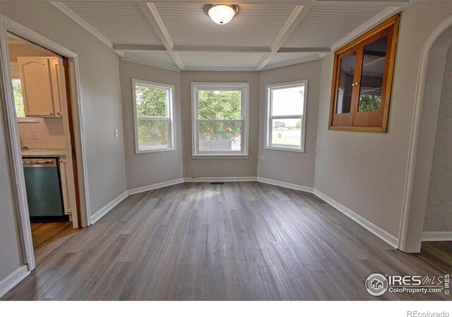 interior space with coffered ceiling and wood-type flooring