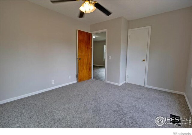 unfurnished bedroom with carpet and ceiling fan