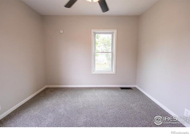 carpeted empty room featuring ceiling fan