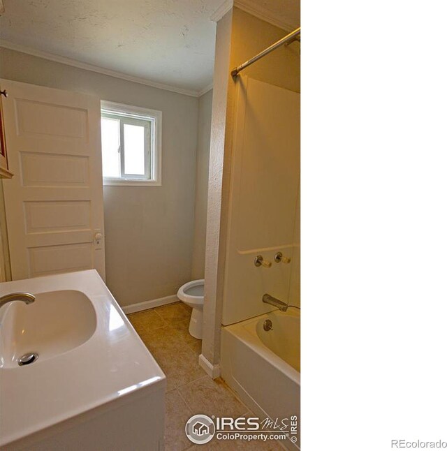 full bathroom featuring toilet, vanity, ornamental molding, tile patterned floors, and shower / tub combination