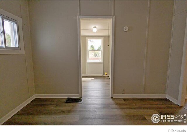 unfurnished room featuring hardwood / wood-style floors