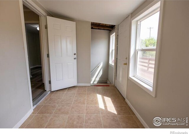 interior space featuring light tile patterned floors