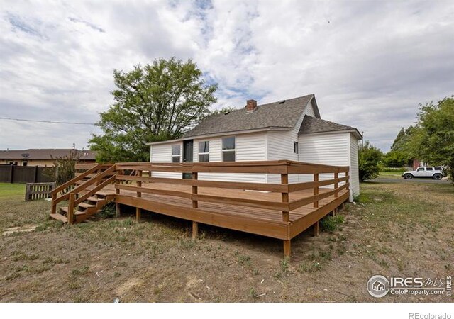 back of house with a wooden deck