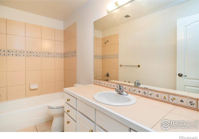 full bathroom with washtub / shower combination, visible vents, vanity, and toilet