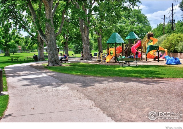 communal playground featuring a yard