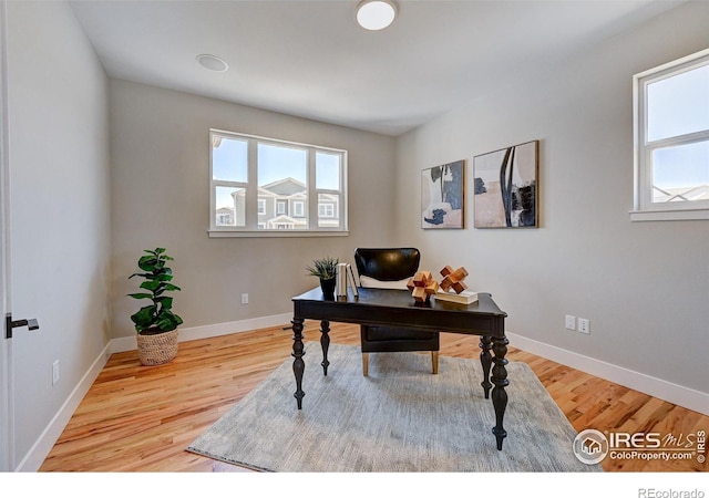 office with light hardwood / wood-style floors