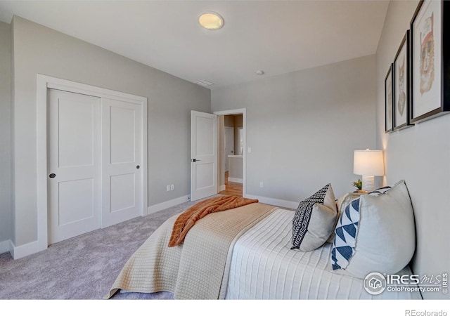 carpeted bedroom with a closet