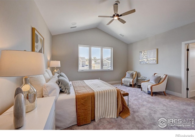 carpeted bedroom featuring ceiling fan and vaulted ceiling