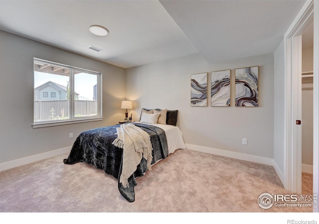 bedroom featuring light carpet