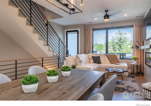 living room with recessed lighting and stairs