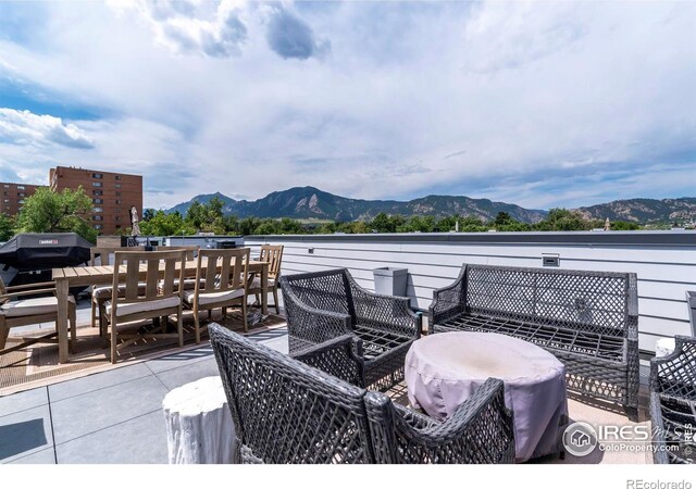 view of patio / terrace featuring a mountain view