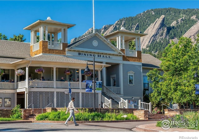 view of property featuring stairway and a mountain view