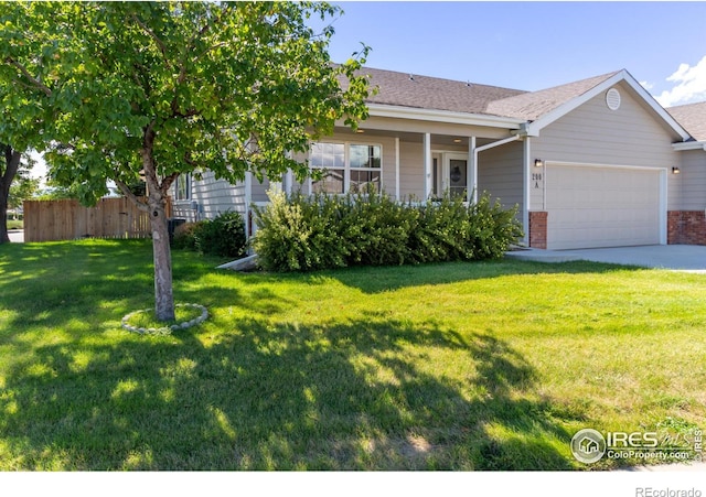 view of front of house with a front lawn and a garage