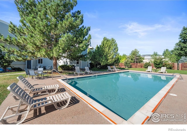 view of swimming pool with a patio area