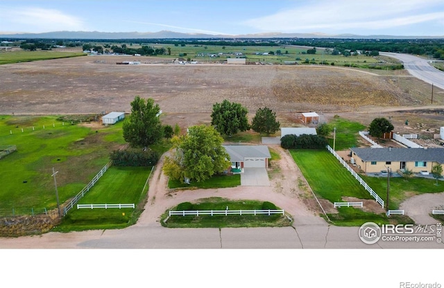 bird's eye view with a mountain view and a rural view