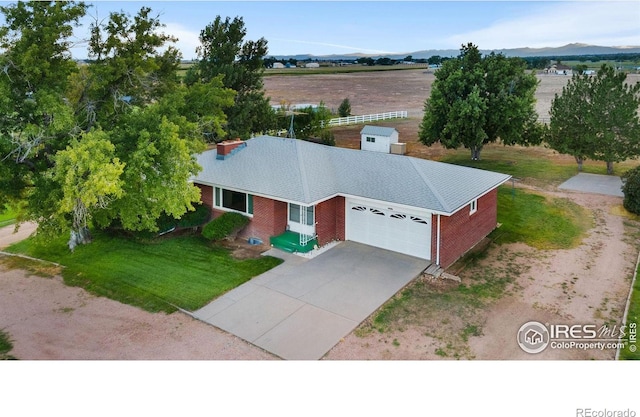 birds eye view of property with a mountain view