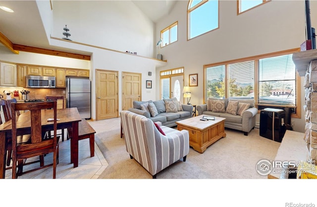 living room featuring light tile patterned floors and a towering ceiling