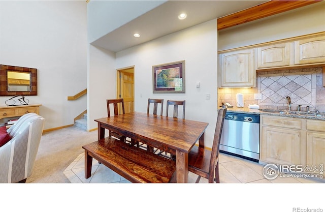 carpeted dining space featuring sink