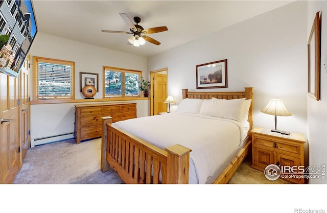 carpeted bedroom with ceiling fan and a baseboard radiator