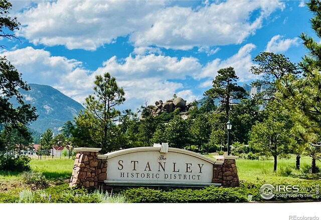 community sign featuring a mountain view