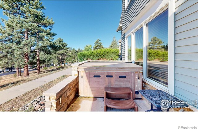 view of patio with a hot tub