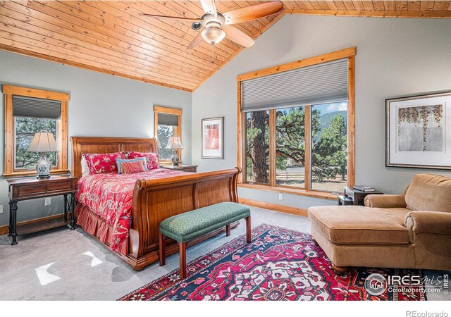 bedroom with lofted ceiling, wooden ceiling, light carpet, and baseboards