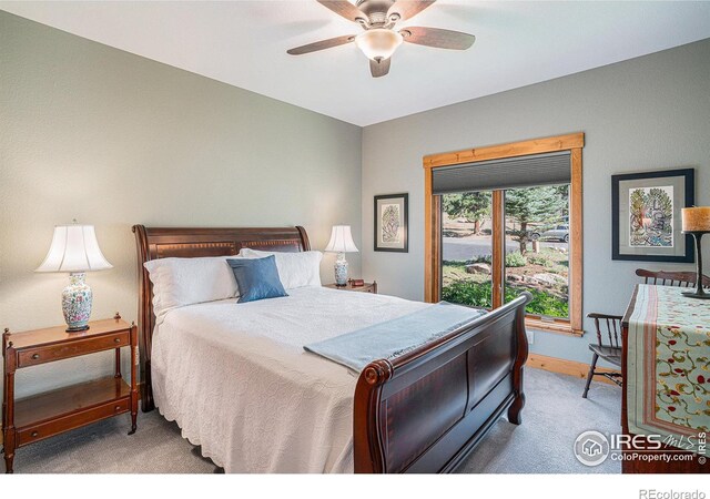 carpeted bedroom featuring ceiling fan