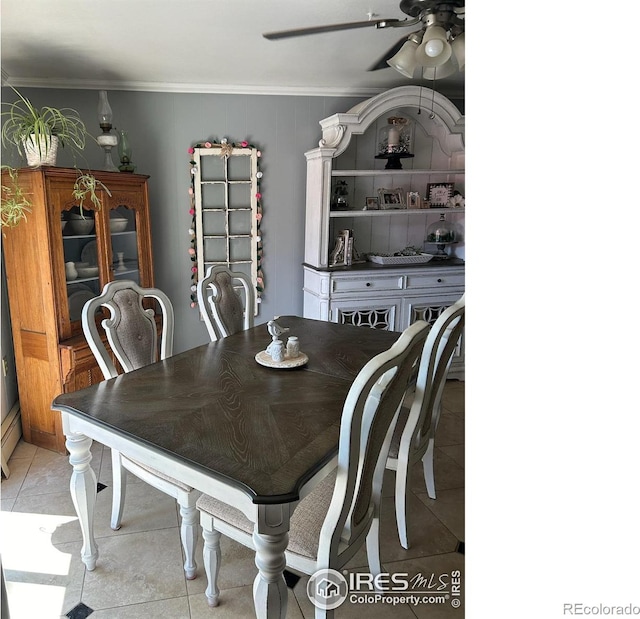 dining space featuring light tile patterned floors, ornamental molding, and a ceiling fan