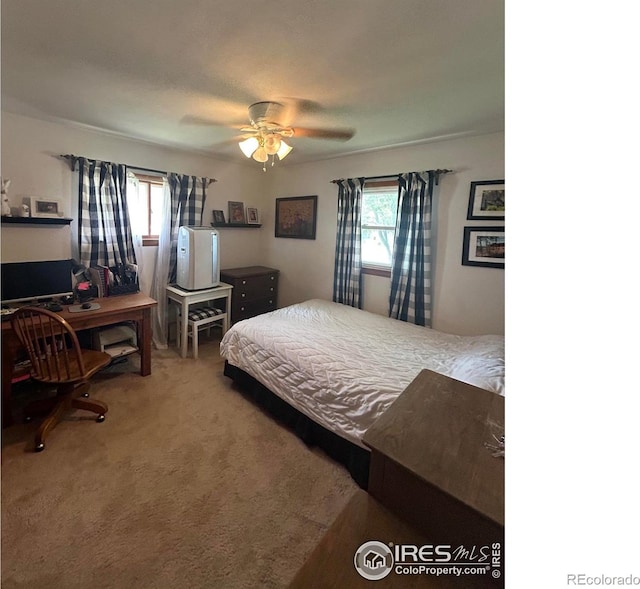 carpeted bedroom with a ceiling fan