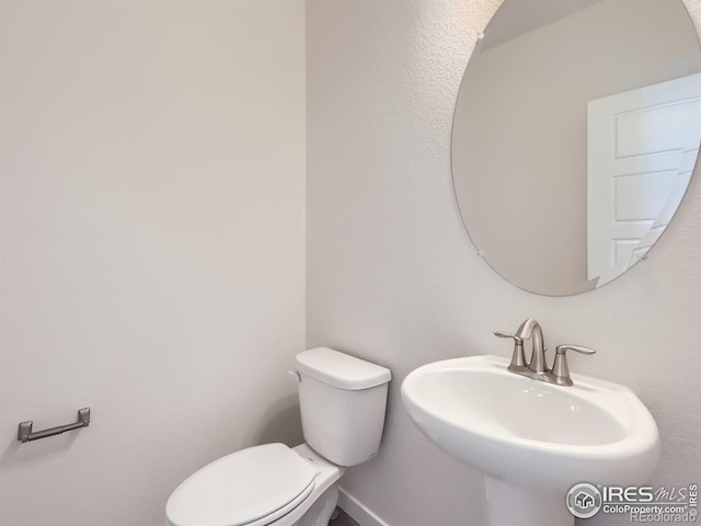 bathroom with sink and toilet