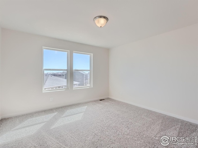 empty room with carpet flooring