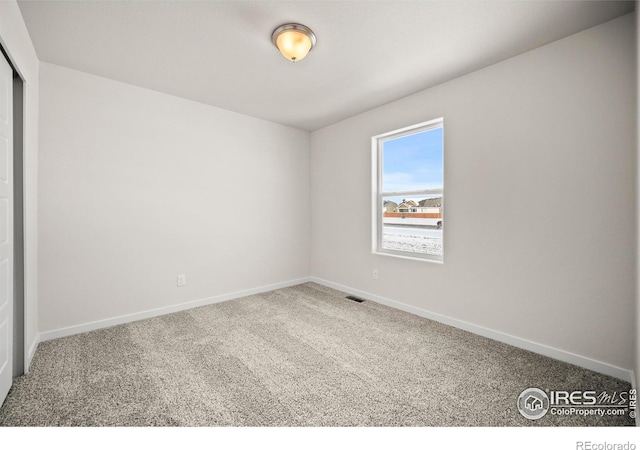 empty room featuring carpet