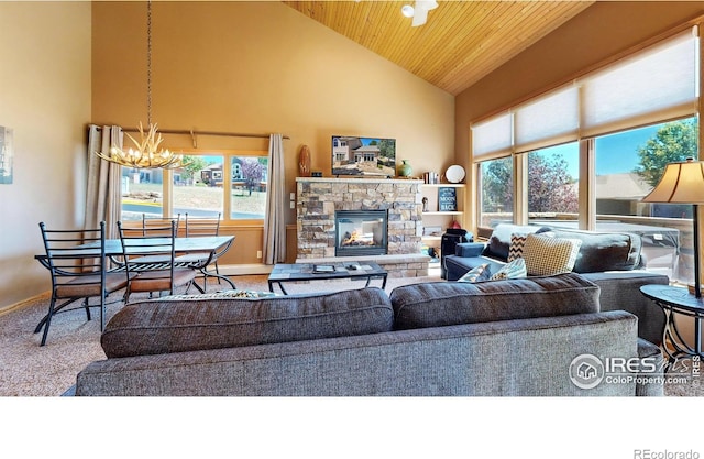349 Overlook Ln, Estes Park, CO 80517 - carpeted living area featuring high vaulted ceiling, a chandelier, baseboards, wood ceiling, and a stone fireplace