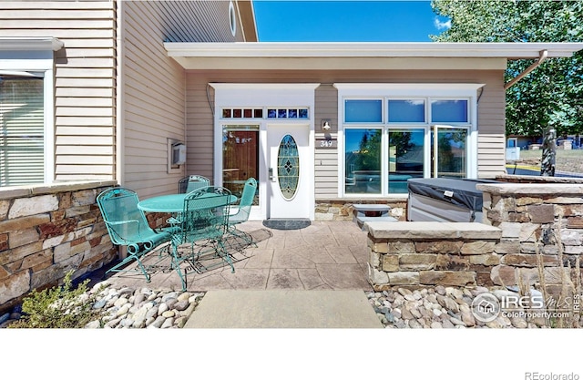 349 Overlook Ln, Estes Park, CO 80517 - doorway to property featuring a patio area and stone siding
